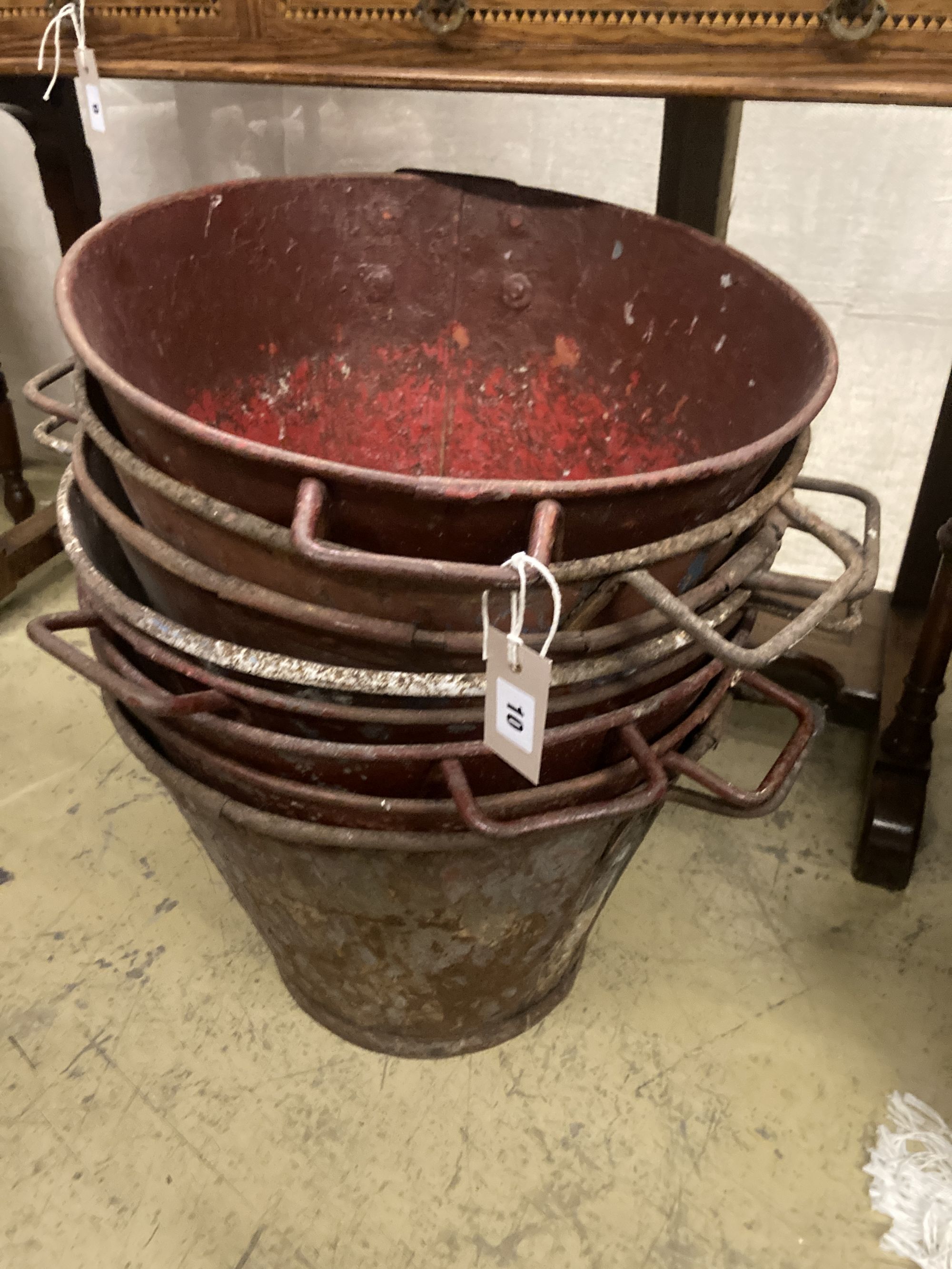 Eight early painted metal florist buckets, diameter 48cm height 36cm
